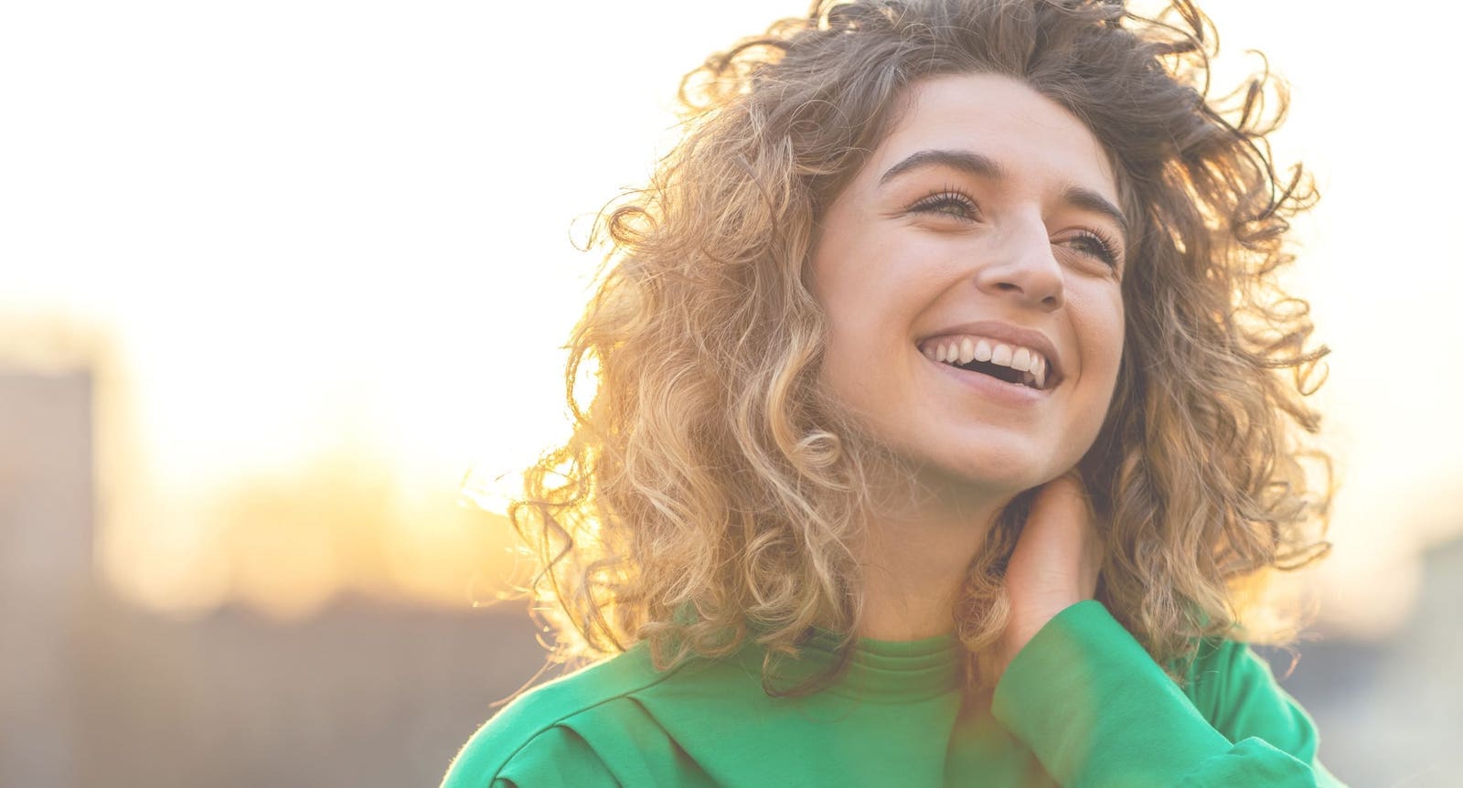 Happy woman in a green sweater