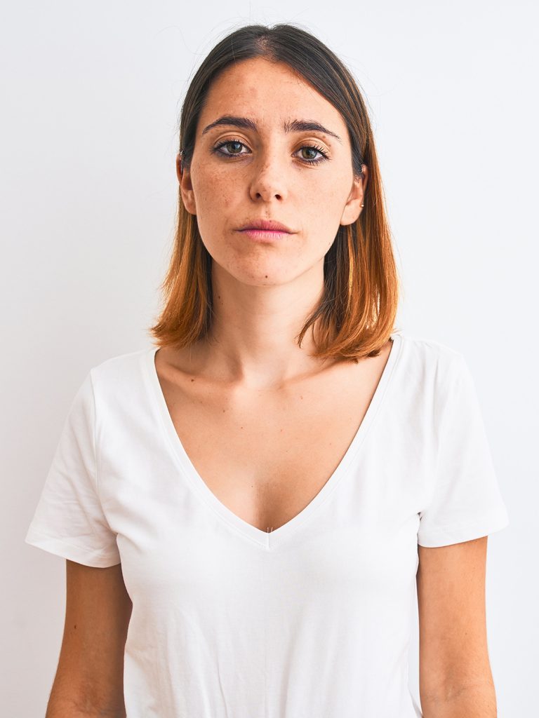 Woman in a white v-neck shirt