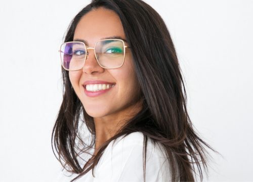 Happy woman with glasses after a pregnancy evaluation