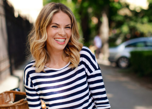 Blonde woman in striped shirt